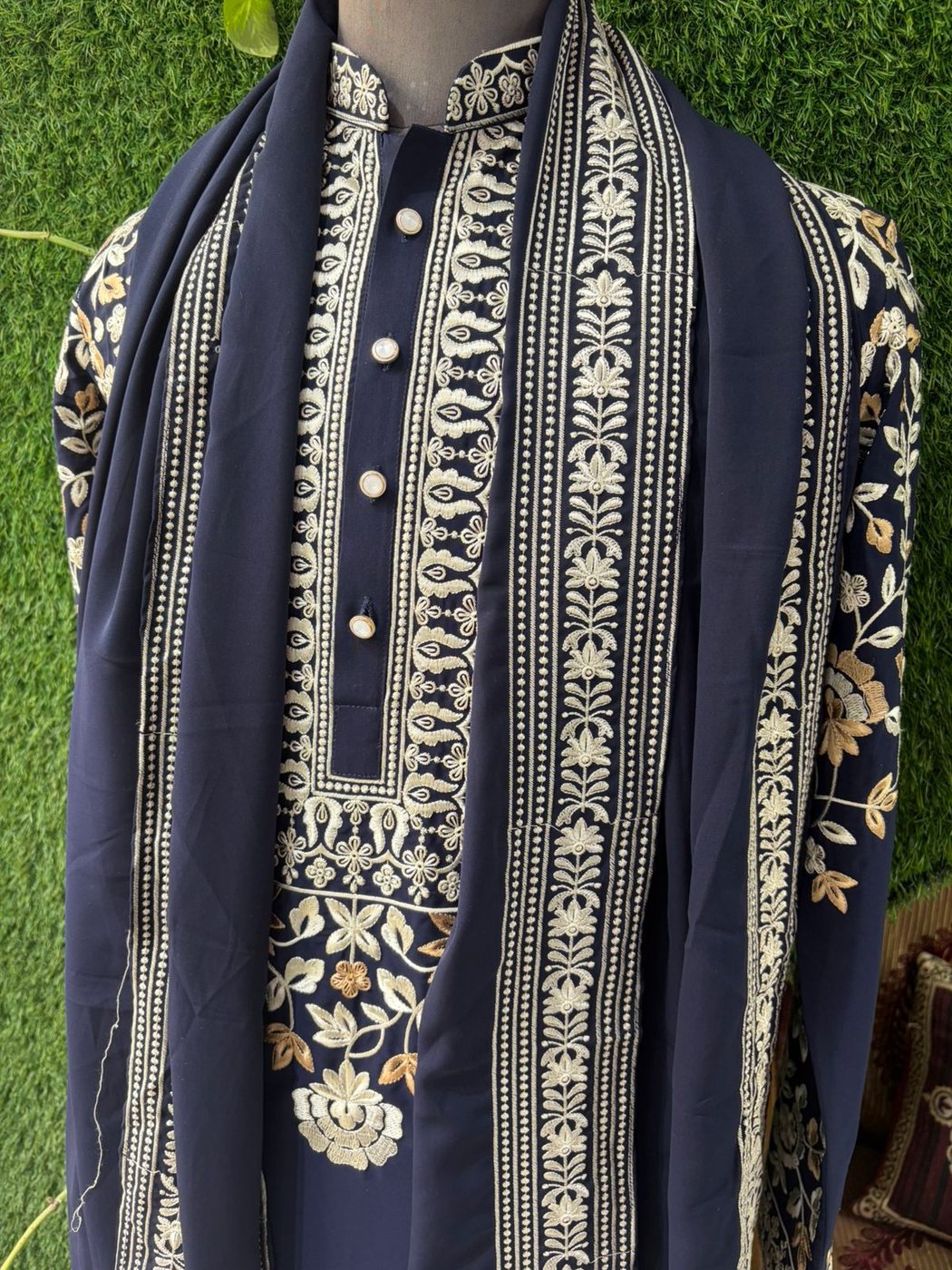 A navy kurta with a heavily embroidered dupatta